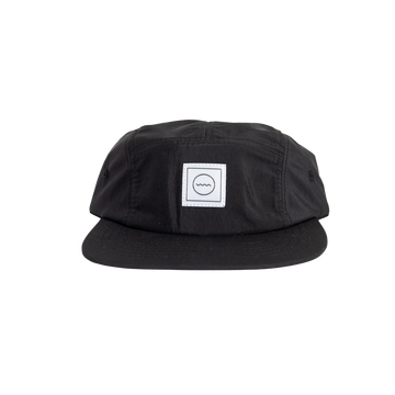 A black nylon five-panel hat with an adjustable velcro back and fabric eyelets on the side panels. It features a white square logo on the front.